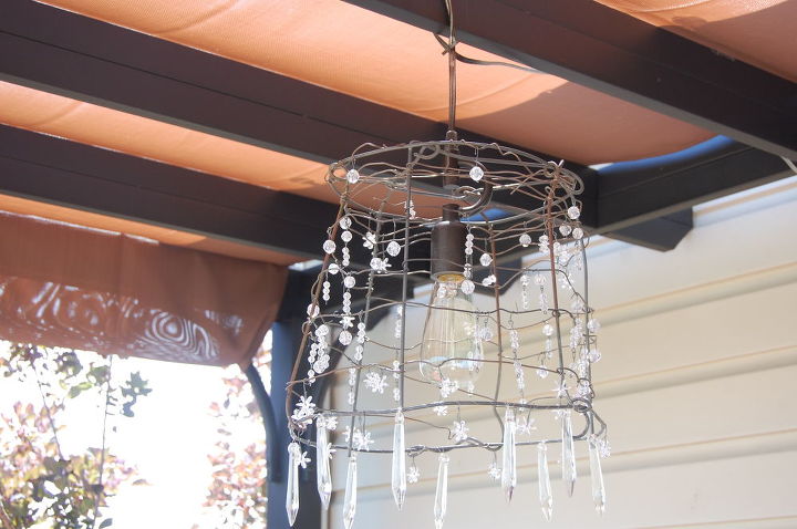turning a tomato cage into a chandelier, electrical, lighting, repurposing upcycling, piglogsandtaterberries blogspot com 2012 06 secret life of outdoor chandelier html