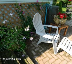 fun and bright brick patio, outdoor furniture, outdoor living, patio, use vertical space my attaching trellis to the side and planting vines This space has a sweet pea vine hosta and columbine