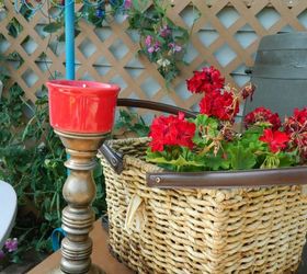 fun and bright brick patio, outdoor furniture, outdoor living, patio, Take a floor lamp base add a hanging flower basket flipped upside down and cover it with solar lights outdoor lamp A basket is sprayed with polyurethane to help it last in the outdoors