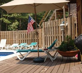 my pool and front yard outdoor living areas were all done on tight and real budgets, decks, fireplaces mantels, outdoor furniture, outdoor living, pool designs, I pick up umbrellas at yard sales and CL Adds shade and creates another sitting area