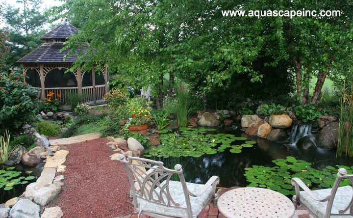 outdoor living with water gardens, curb appeal, decks, outdoor living, patio, ponds water features, A bridge across the water garden leads to a gazebo waterfall and firepit