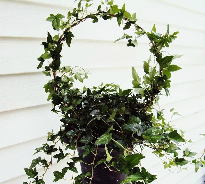 15 insanely smart hanger hacks you ll wish you d seen sooner, Set a porch topiary for spring