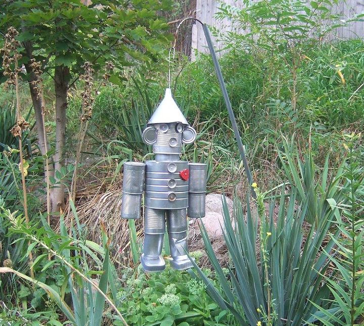 15 insanely smart hanger hacks you ll wish you d seen sooner, Build a tin can tin man for your garden