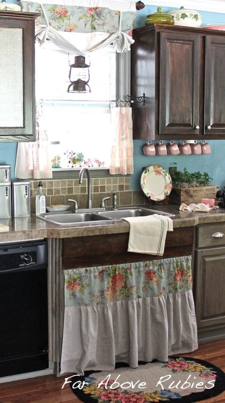 vintage farm kitchen, home decor, kitchen design, painted furniture, Painted and distressed grey lower cabinets stained walnut upper and black upper cabinets Repurposed wood trim used to give the impression of a farmhouse sink