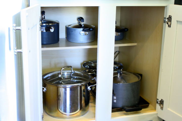 making a kitchen cabinet more functional, kitchen cabinets, shelving ideas, Before The cabinet was narrow and it was difficult to get pots pans in and out