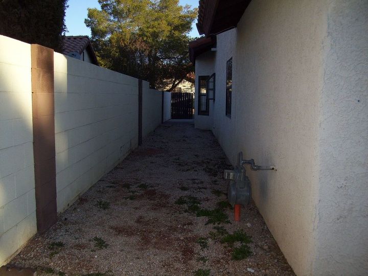 narrow side yard, gardening, outdoor living, Before So ugly and uninviting We painted our bolck walls a more cream color and painted all previously dark brown colomns and gate a soft tan