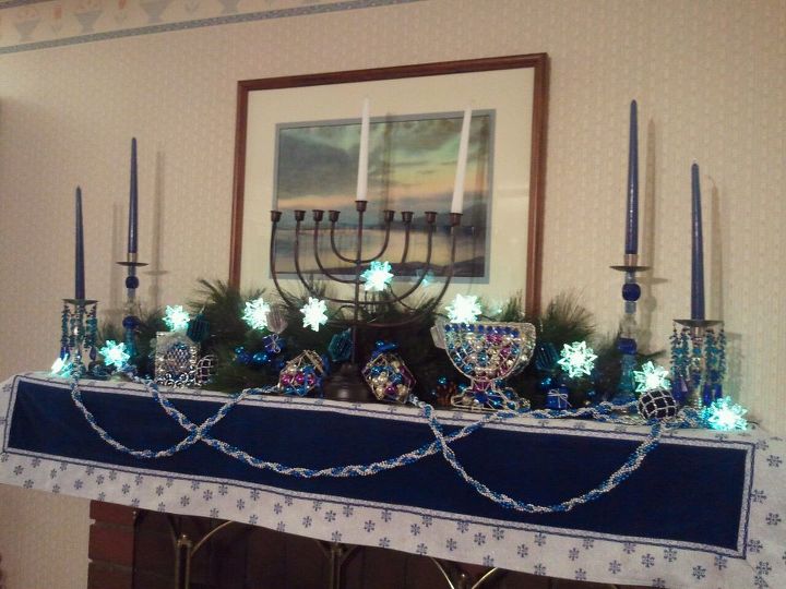 chanukah mantelpiece designs, christmas decorations, seasonal holiday d cor, The family room mantelpiece keeps the Channukah spirit going For parties we light the huge menorah and let the taper candles burn 8 hours