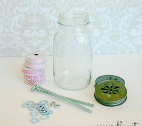a fun way to organize your craft room, organizing, I wanted to display the twine in a mason jar and be able to pull it through the cut outs in a daisy lid but I had to find a way to keep it from getting jumbled up inside