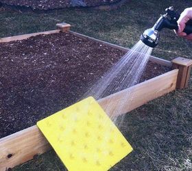 fastest way to plant a raised garden bed, gardening, raised garden beds, Water your freshly planted bed and hose down the Stamp