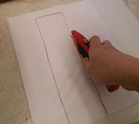 grouted vinyl tile, bathroom ideas, flooring, tile flooring, tiling, Iplaced the template on the tile and cut the tile with a utility knife Shallow cuts do the trick and then you can just pop the piece out