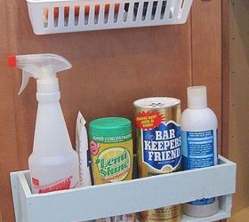kitchen organization, closet, diy, shelving ideas, storage ideas, woodworking projects, My husband built a cleaning caddy for the door under the sink It holds our most used kitchen cleaners Above it small adhesive hooks hold a plastic container for sponges scrubbers keeping them in easy reach