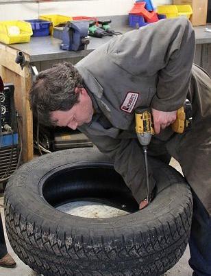 up cycled tire planter, container gardening, flowers, gardening, perennials, repurposing upcycling, Step 3 Securely fasten junk tire to base with long screws