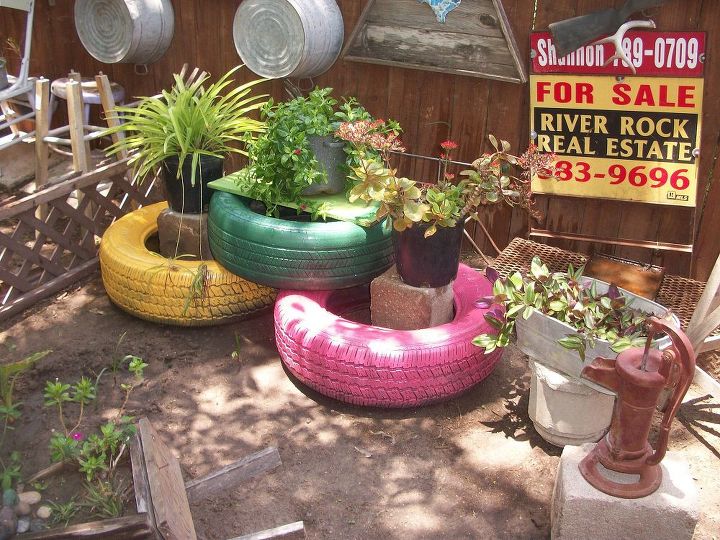 my colorful tires, gardening, repurposing upcycling, Spray painted old tires I had around the house to add some color to my back yard