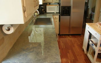 Concrete overlay replicating rare blue marble countertop and sandstone brick backsplash--very affordable-770-310-3361