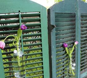 using old shutters in the garden, Originally the shutters were joined together to create a privacy screen