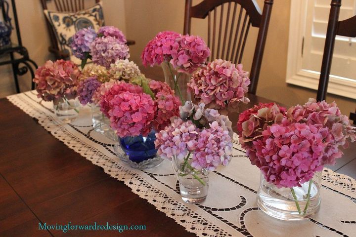 drying hydrangeas, crafts, flowers, gardening, hydrangea, Displaying the blooms on my dinning room table in several jars and vases with a few inches of water