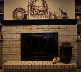 painting a brick fireplace with chalk paint, The fireplace is bright clean and modern The mantel painted in Graphite Chalk Paint really makes a bold statement We painted the metal surround with Rust oleum High Heat Paint