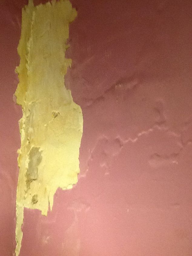our house built in 1902 multiple moisture problems need fixing, Inside wall of chimney that goes up through our bedroom Was repaired last spring This is now January and has been bubbling and peeling ever since I scraped this all off yesterday Mess on floor daily