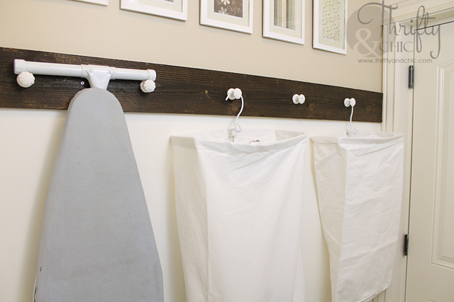 diy laundry room organization, laundry rooms, organizing, storage ideas, I hung knobs on the wall and placed the hanging laundry bags on them Also found a perfect spot to hang the ironing board out of the way