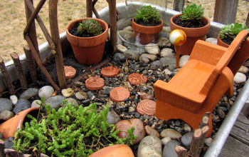 Un jardín en miniatura de terracota y suculentas