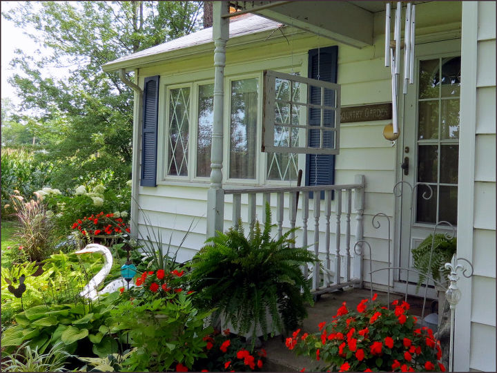 what to do to old window pane hanging on porch, I put up this old window over my porch railing this morning but would like to add something else with it