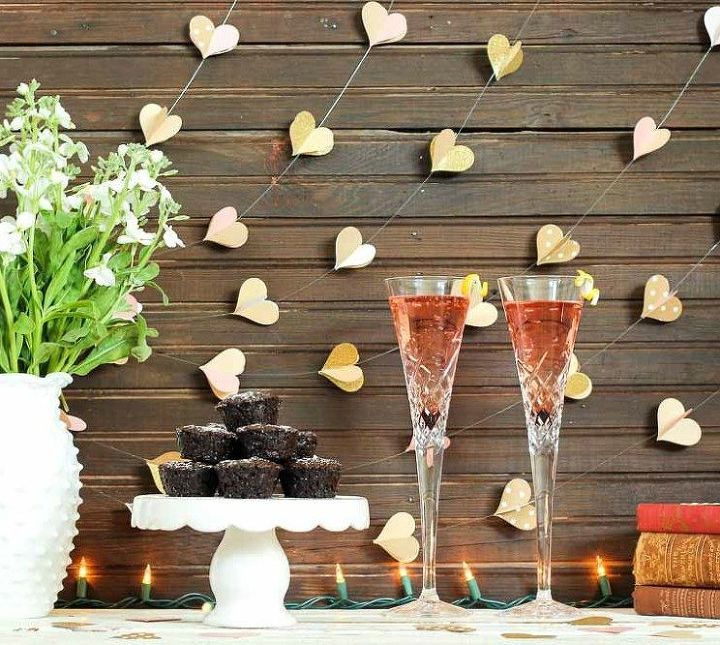 s 21 romantic heart decorations you might want to leave up all year, valentines day ideas, wall decor, Fill the wall with paper garlands