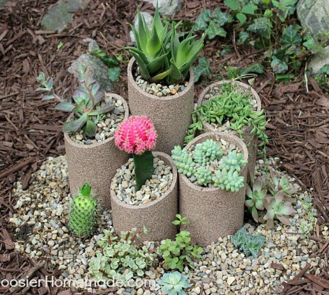 s 17 amazing garden features we ve been saving for summer, gardening, outdoor living, ponds water features, These spray painted PVC planters