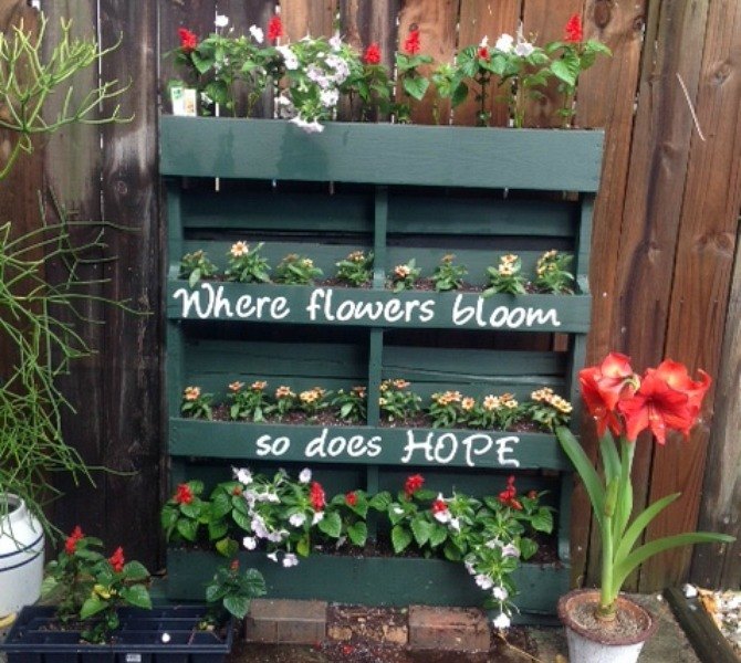 s 17 amazing garden features we ve been saving for summer, gardening, outdoor living, ponds water features, This feel good vertical pallet planter