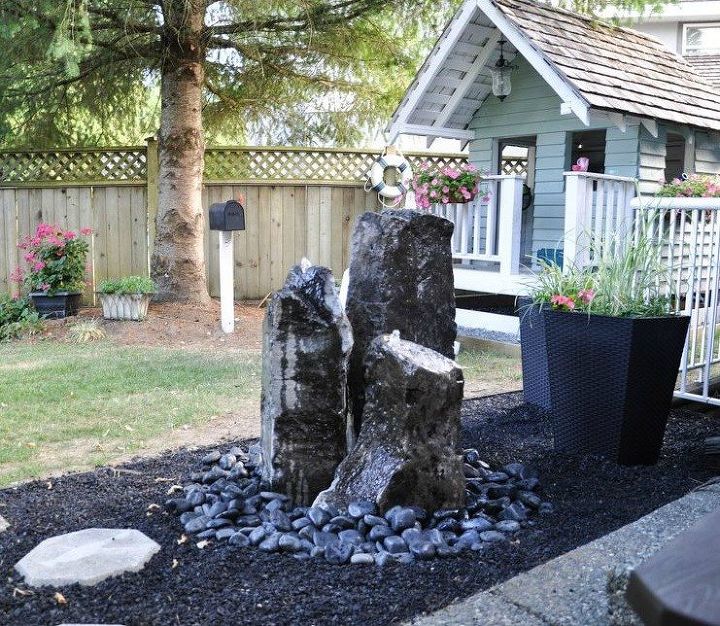 s 17 amazing garden features we ve been saving for summer, gardening, outdoor living, ponds water features, Their rocky backyard fountain
