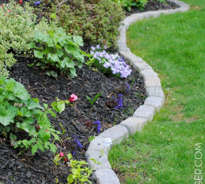 s 17 amazing garden features we ve been saving for summer, gardening, outdoor living, ponds water features, A pristine garden edge with stones