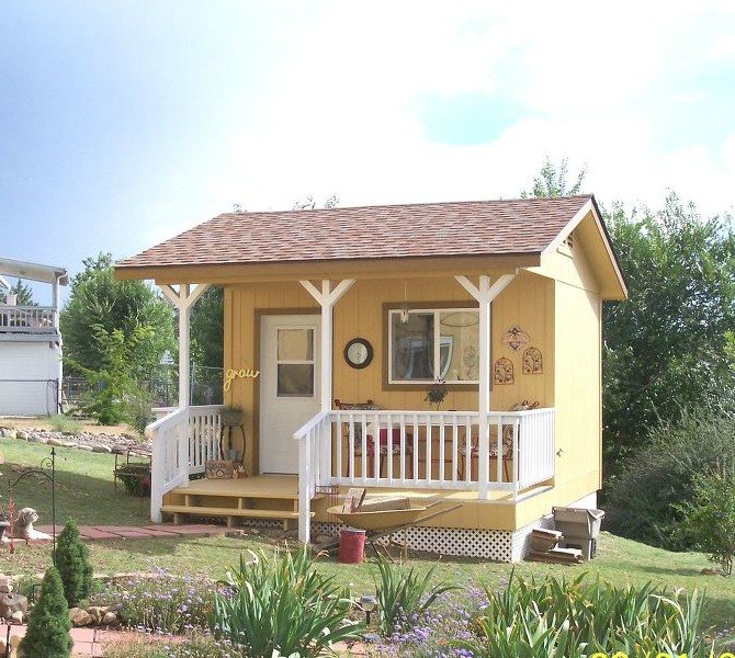 s 11 sheds to show your handy husband this summer, outdoor furniture, outdoor living, Her Charming Golden Cottage from Scratch