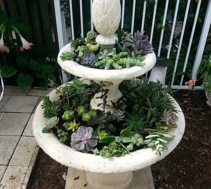s 13 planter ideas that blow all other planters out of the water, container gardening, gardening, repurposing upcycling, Upcycle a fountain into a statement planter