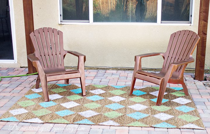s 13 expensive looking outdoor rug ideas that cost less than 20, flooring, outdoor living, reupholster, Update last year s worn rug with a pattern