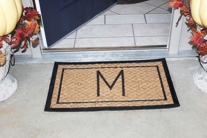 13 expensive looking outdoor rug ideas that cost less than 20, Add a large monogram to a doormat
