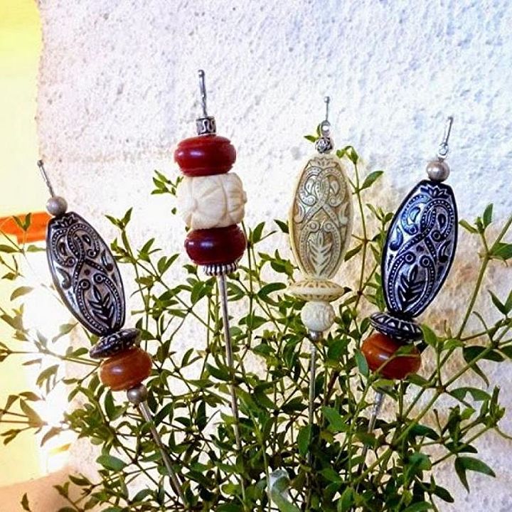 don t ditch your broken umbrella til you see what people do with them, Bead the broken spokes for ornamental sticks