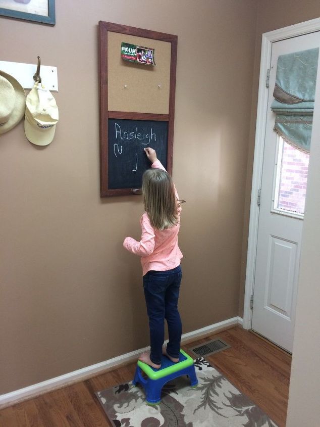 repurposed kitchen cabinet door covers ugly fuse box, She Loves It