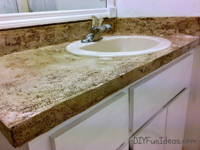 11 low cost ways to replace or redo a hideous bathroom vanity, Give the top a patchy concrete look