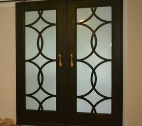 12 clever tricks to turn builder grade doors into custom made beauties, Cut out the center and replace it with glass