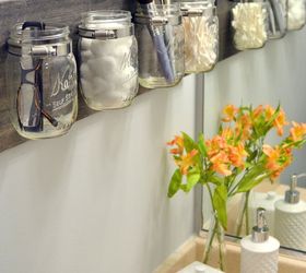 13 tricks people who hate bathroom clutter swear by, Make a mason jar organizer for the wall