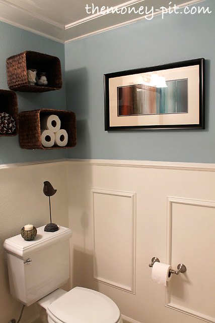 13 tricks people who hate bathroom clutter swear by, Get easy shelves by putting baskets on a wall