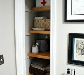 13 tricks people who hate bathroom clutter swear by, Use baskets to corral cupboard clutter
