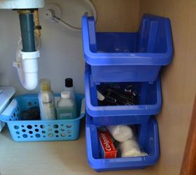 13 tricks people who hate bathroom clutter swear by, Grab cheap bins to organize under the sink