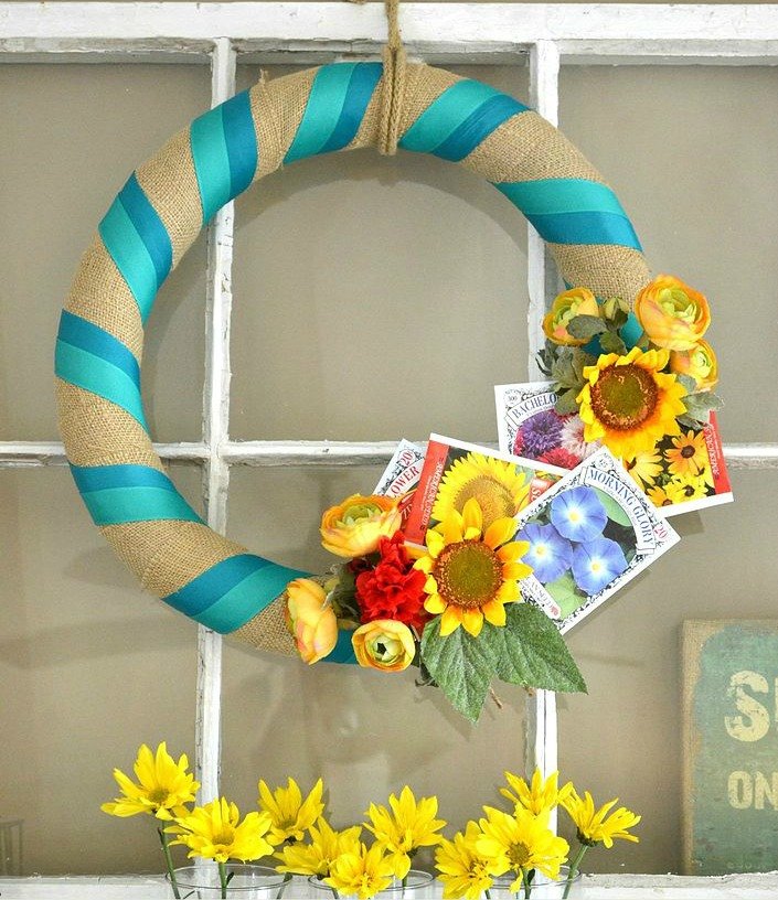 s 31 gorgeous spring wreaths that will make your neighbors smile, crafts, seasonal holiday decor, wreaths, Add some seed packets to a simple wreath