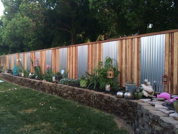 15 privacy fences that will turn your yard into a secluded oasis, Accent an ordinary fence with sheet metal