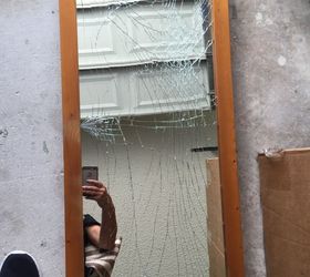 How do you remove broken glass from stand up mirror?