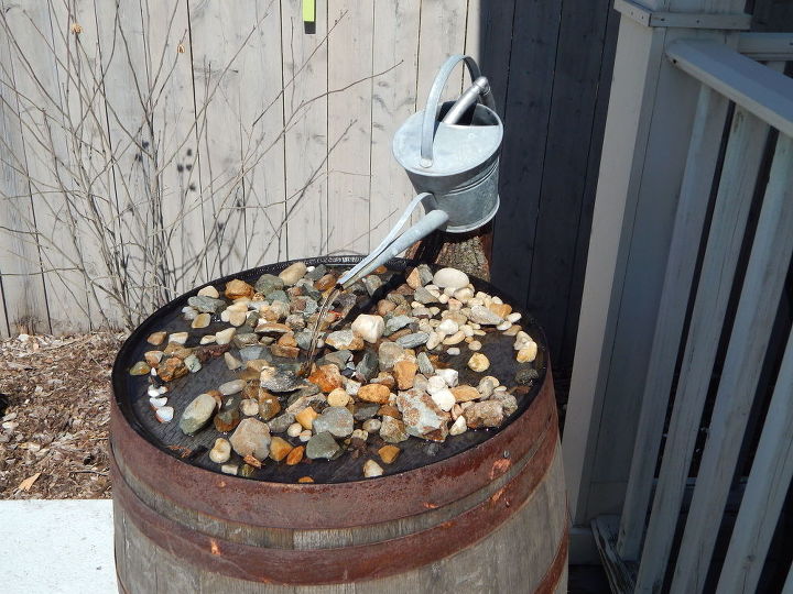 wine barrel fountain with vintage watering can, ponds water features