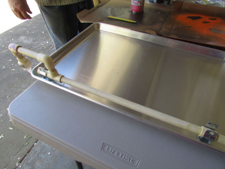 making a hummingbird water and bathing tray out of a cookie sheet