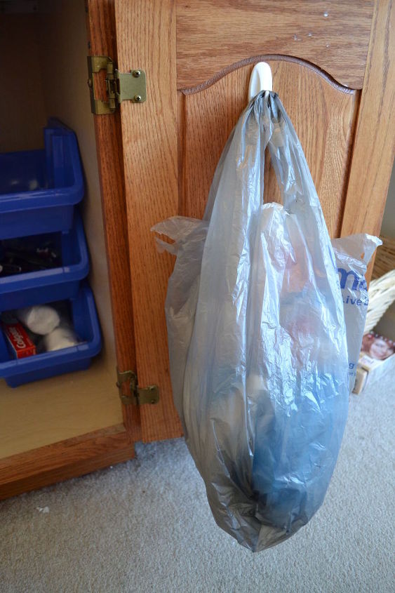 s 14 hidden home decor gems you can find in any dollar store, home decor, repurposing upcycling, Sticky coat hooks solve shopping bag storage