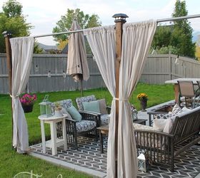 s 15 budget outdoor updates to turn your yard into a relaxing getaway, outdoor furniture, outdoor living, Close off a corner with poles curtains