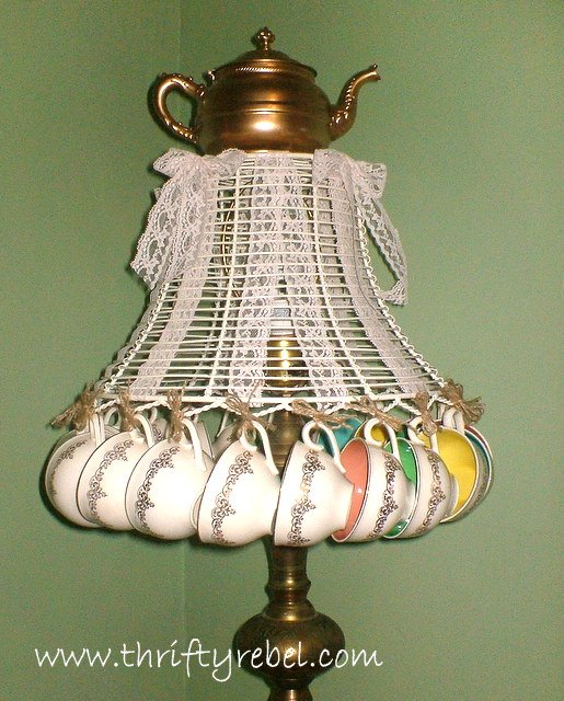 don t ditch your broken teacups til you see what people do with them, String chipped cups around a lamp frame